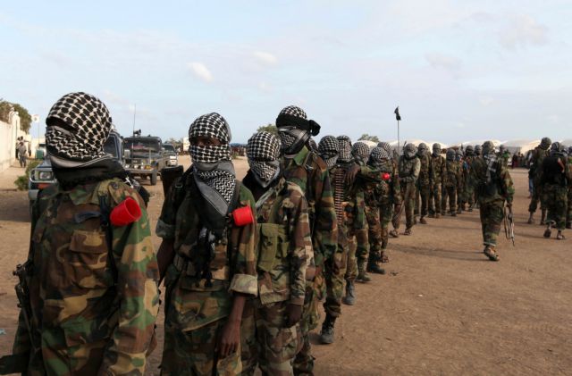 FILE PHOTO: Members of Somalia's al-Qaeda linked al Shabaab militia parade after distributing relief to famine stricken internally displaced people at Ala Yaasir camp