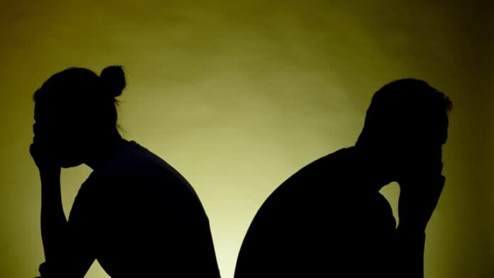 Couple. Back to back. Silhouette.